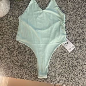 Really soft feels amazing on your skin bodysuit It’s a beautiful mint green